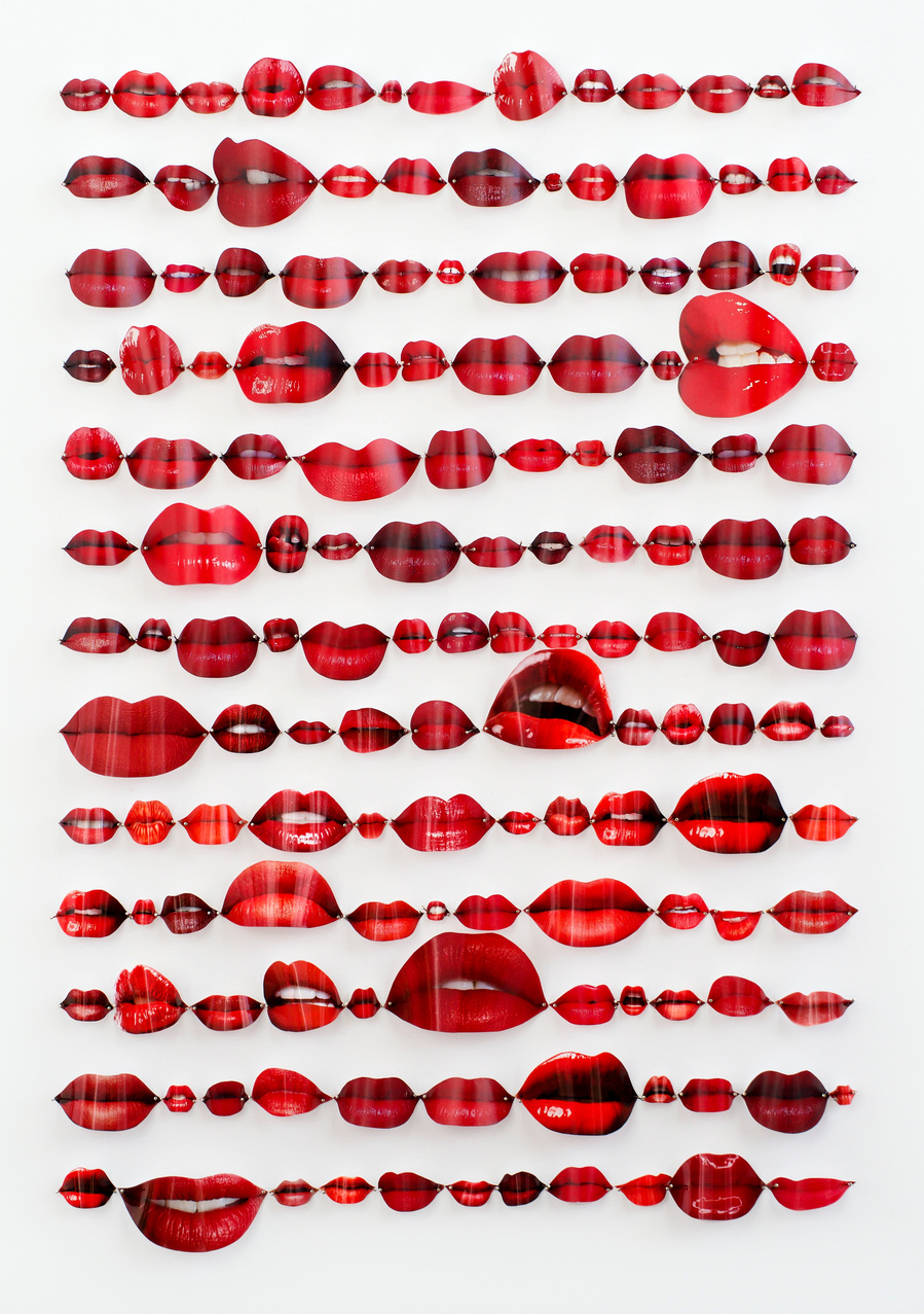 Speechless is an analogue collage of red lips torn from Vogue,  Elle, Harpers Bazaar fashion magazines bowed/curved and pinned on a white background like butterfly specimens. By Australian contemporary visual artist Di Allison, HALLISON Studios Tasmania.
