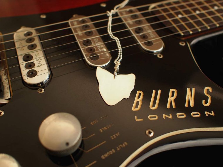 Van Diemen's detachable, wearable sterling silver guitar pick pendant, Di Allison, HALLISON Studios, online jewellery. Music inspired jewelry, bijoux, shape of Tasmania, map of Tassie photographed on a vintage 1960s electric Burns of London guitar.