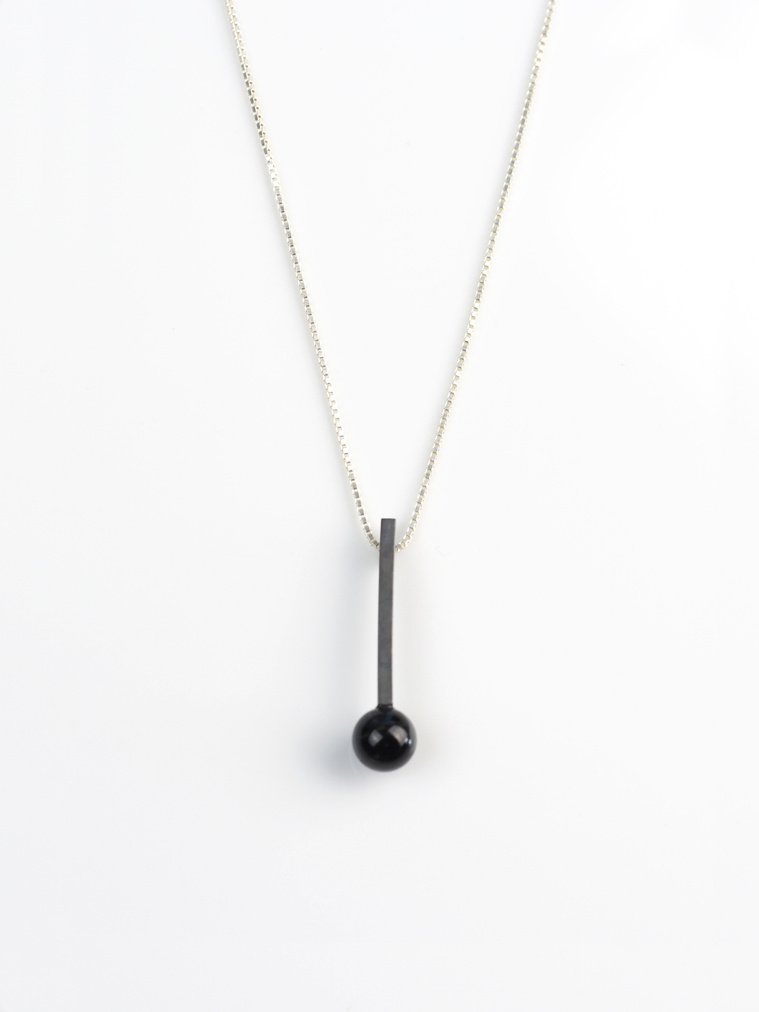 Exclamation pendant by contemporary jeweller Di Allison, HALLISON Studios, Tasmania, online gallery store. Black onyx beads on oxidised sterling stems, inspired by typography, text, punctuation, exclamation mark!
