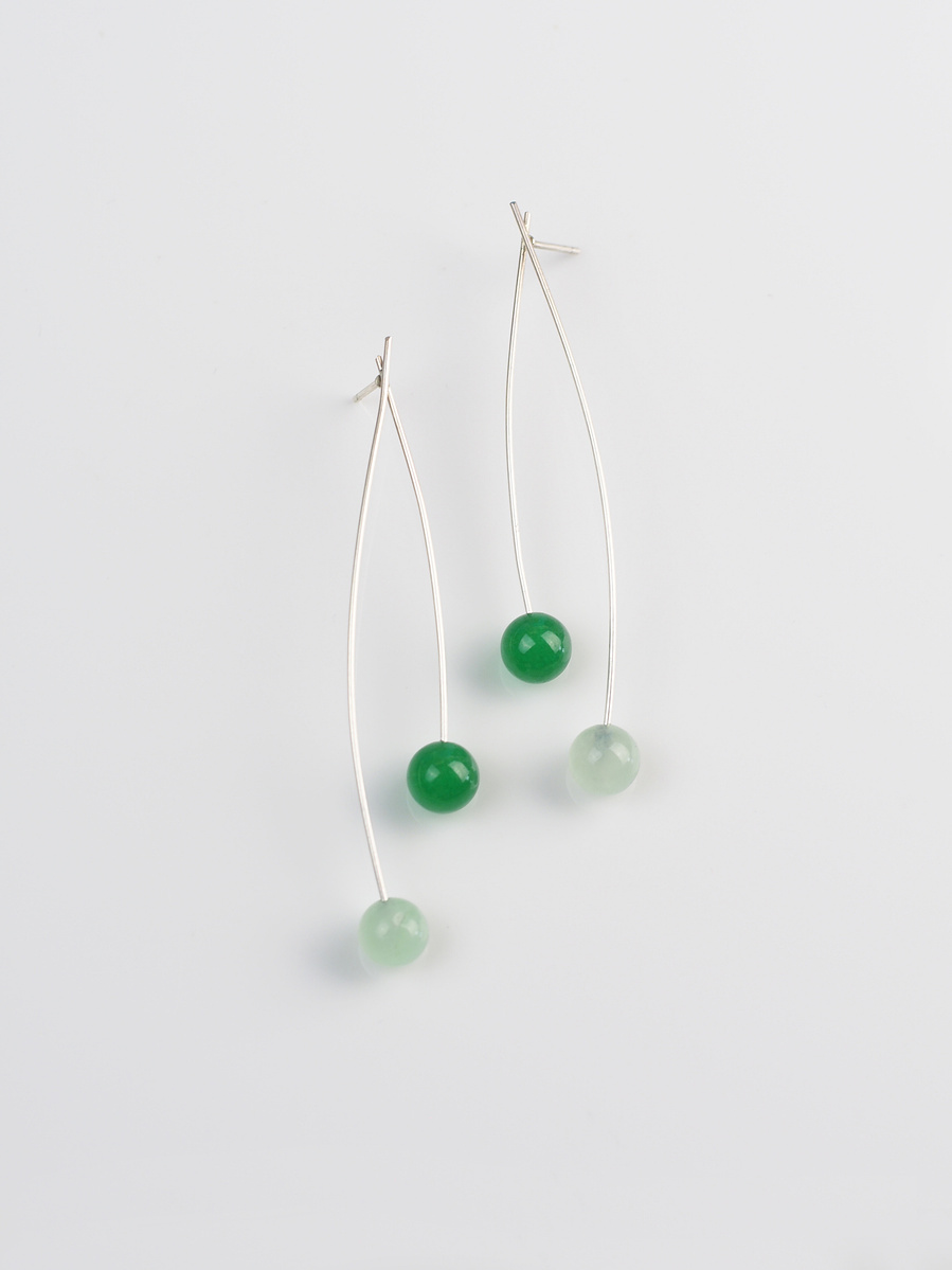 Contemporary minimalist earrings of green agate and sterling silver by jeweller Di Allison of HALLISON Studios, Tasmania, entitled Highlands: Sway suggestive of the button grass of the Tasmanian Central Highlands.