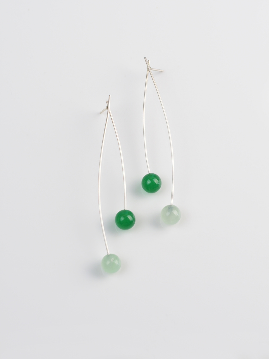 Contemporary minimalist earrings of green agate and sterling silver by jeweller Di Allison of HALLISON Studios, Tasmania, entitled Highlands: Sway suggestive of the button grass of the Tasmanian Central Highlands.