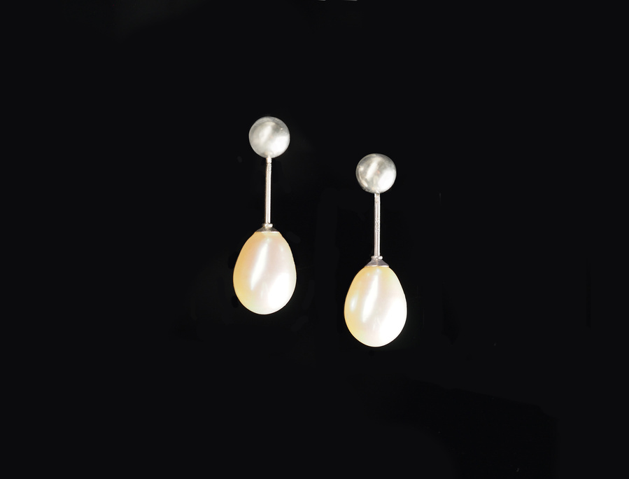 Sterling silver and freshwater pearl earrings on a black background by contemporary jeweller Diane Allison of HALLISON Studios, Tasmania, entitled  Knit 1 Purl 1 [K1 P1].