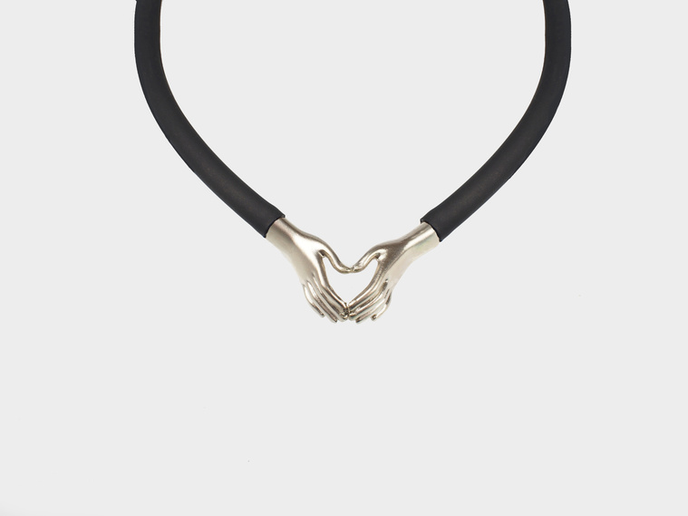 Contemporary jewellery by Di Allison, HALLISON Studios, Tasmania, online gallery. Still Your Hands and Still Your Heart pendant inspired by Nick Cave song lyric, features sterling silver hands forming a love heart.