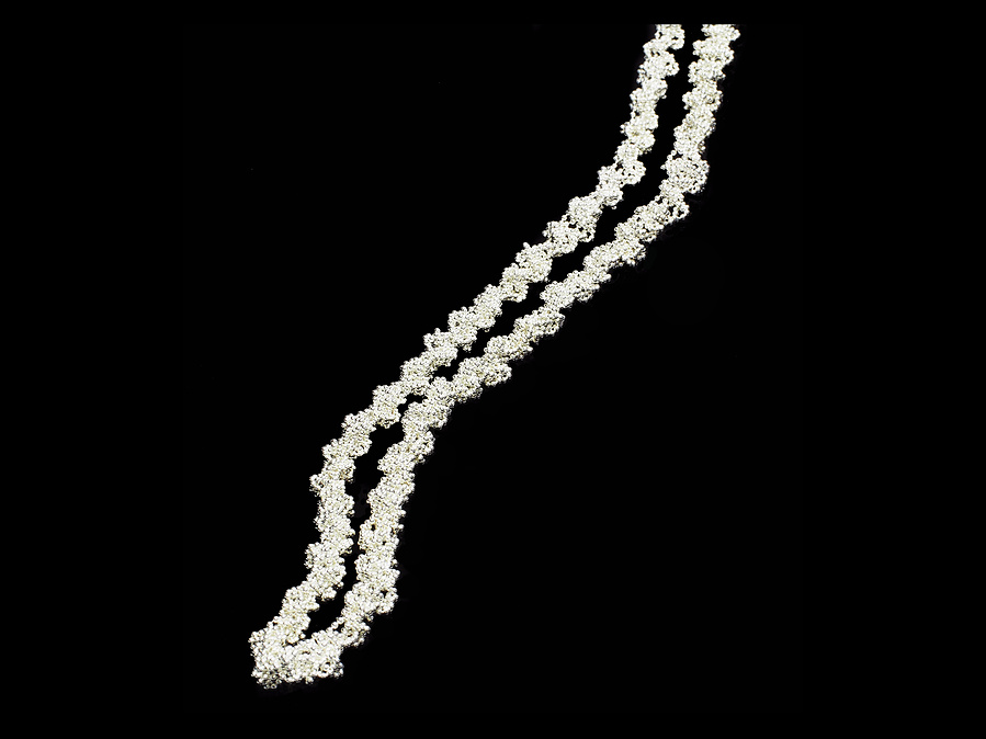 Classic style with a twist: the Twist necklace is a luxuriously long bright sterling silver necklace [which can be worn as a single, double or triple strand or wrapped as a bracelet] made by contemporary jeweller Diane Allison, HALLISON Studios, Tasmania.