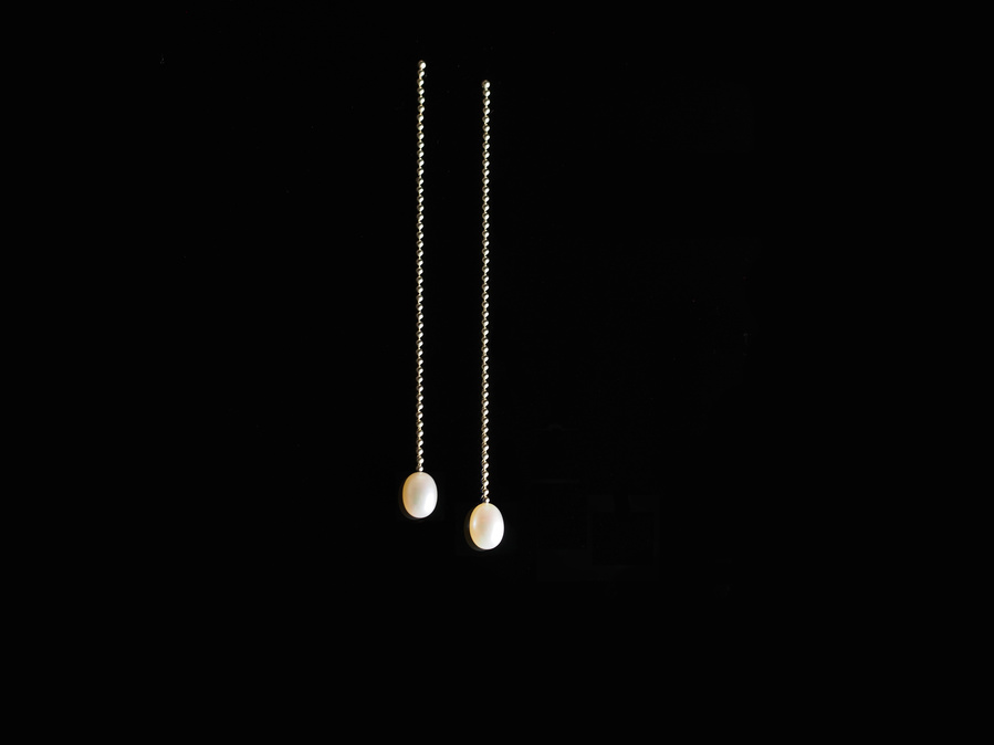 Sterling silver and white freshwater pearl stud dangle earrings entitled Knit 1 Purl 1 Drop Stitch on a black background. Made by contemporary jeweller Di Allison, HALLISON Studios, Tasmania. They feature sterling silver bead/ball chain.