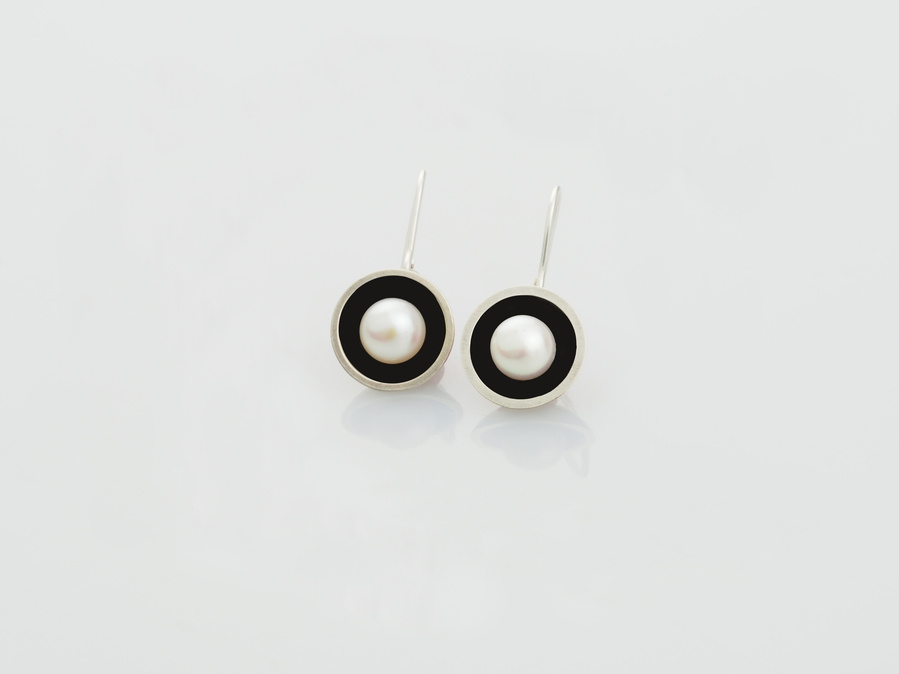 Classic and contemporary connect in these round sterling silver and kiln fired black vitreous enamel earrings, set with luminous freshwater pearls by jeweller Diane Allison, HALLISON Studios, Tasmania, from the Connect the Dots collection.