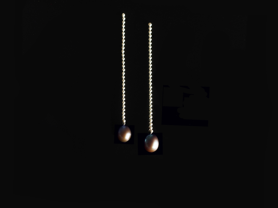 Sterling silver and dark freshwater pearl stud dangle earrings entitled Knit 1 Purl 1 Drop Stitch on a black background. Made by contemporary jeweller Di Allison, HALLISON Studios, Tasmania. They feature sterling silver bead/ball chain.
