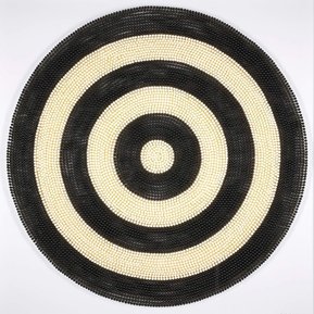 Target #3, an artwork by Tasmanian contemporary artist Di Allison, HALLISON Studios, using empty pill capsules in white and black to form a large circular target, Pop Art like.