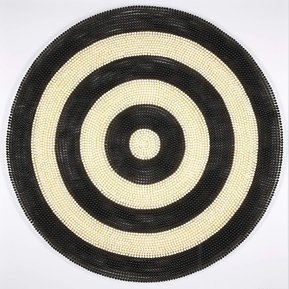 Target #3, an artwork by Tasmanian contemporary artist Di Allison, HALLISON Studios, using empty pill capsules in white and black to form a large circular target, Pop Art like.
