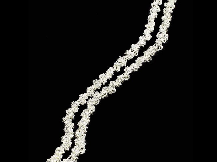 Twist contemporary handmade sterling silver extra long necklace luxuriously long about 1 metre by jeweller Di Allison, HALLISON Studios, Tasmania. Bright silver jewelry jewellery bijoux on black background