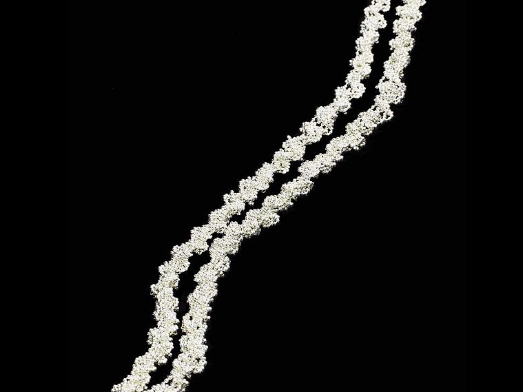 Twist contemporary handmade sterling silver extra long necklace luxuriously long about 1 metre by jeweller Di Allison, HALLISON Studios, Tasmania. Bright silver jewelry jewellery bijoux on black background