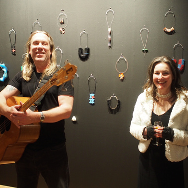 Musician, bass guitarist, Brian Ritchie, Violent Femmes,  opening jewellery exhibition Quaver at Handmark by Tasmanian artist, jeweller Diane Allison of HALLISON Studios -  an exhibition featuring necklaces of guitar picks, plectrums and guitar strings.