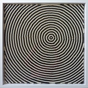 Contemporary art by Di Allison, HALLISON Studios, Tasmania, online gallery. Empty pill capsules arranged in concentric circles, op art / Pop art-like, in colours of black and white. Entitled Radiate #1.