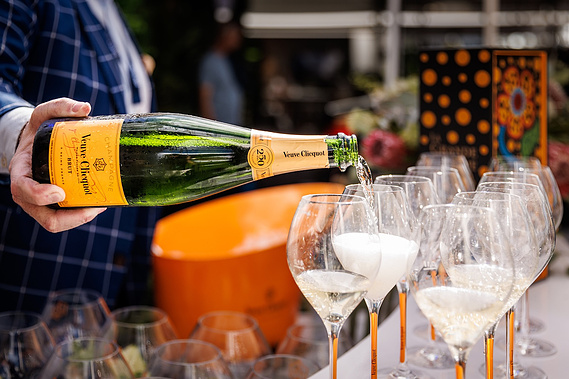Veuve Clicquot champagne is being served at the luxurious Princess Yachts display at Sanctuary Cove International Boat Show. Boat show event photography by boat show event photographer Darren Gill.