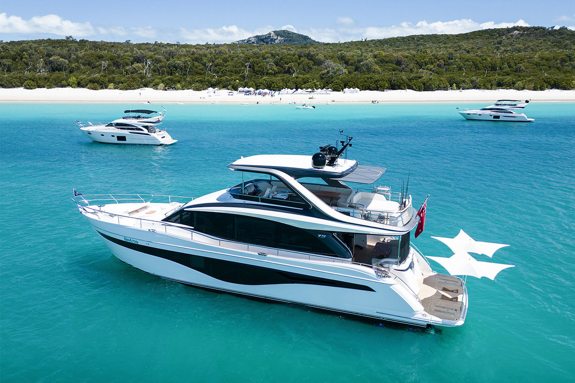 Princess Yachts Y72 anchored off Whitehaven Beach, QLD as part of the Princess Yachts Owners Rendezvous. Photography by Darren Gill.