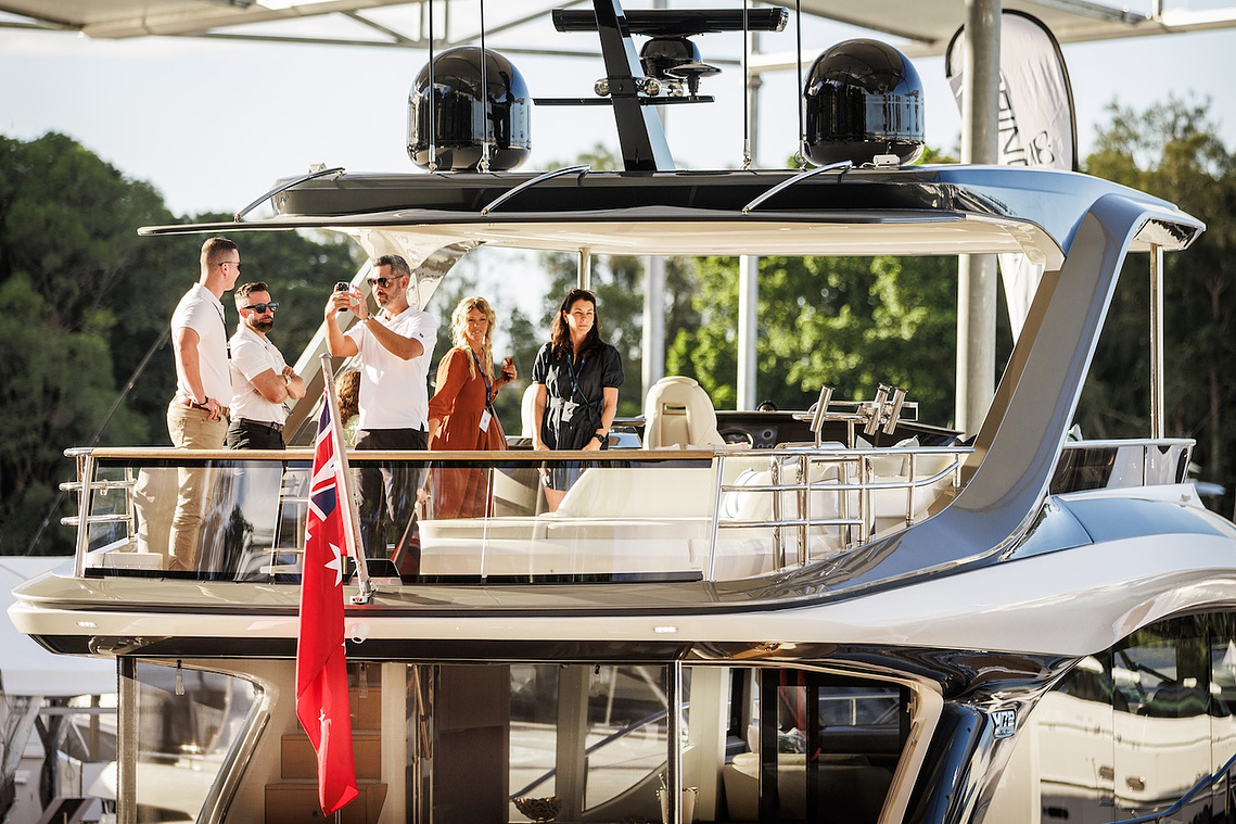 guest enjoying the Princess Yachts Y72 flybridge at the Sanctuary Cove International Boat Show. Boat show photography by Australian boat show photographer Darren Gill.