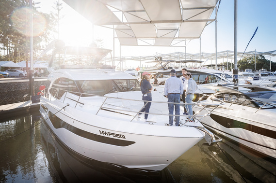 Inspecting the Princess Yachts model lineup at Sanctuary Cove International Boat Show. Boat show photography by boat show photographer Darren Gill.