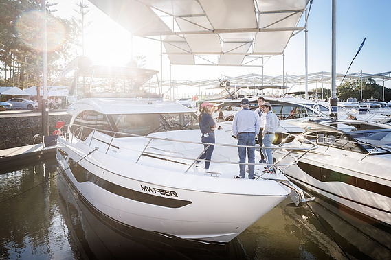 Inspecting the Princess Yachts model lineup at Sanctuary Cove International Boat Show. Boat show photography by boat show photographer Darren Gill.
