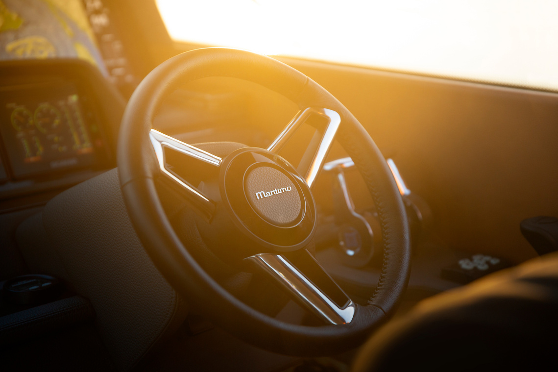 Sunlight shining on the steering wheel of the Maritimo X50 luxury motor yacht photographed by Darren Gill