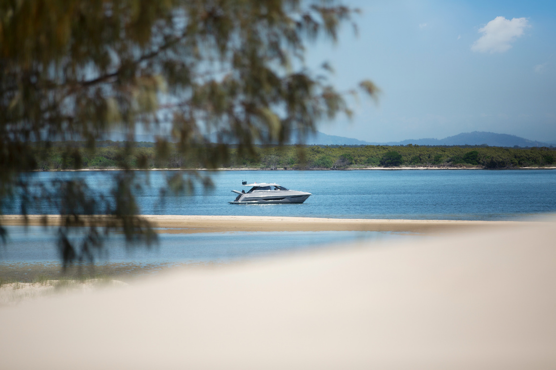 Maritimo X50 luxury motor yacht anchored off an island in Queensland photographed by Darren Gill
