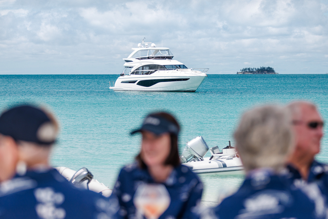 Princess Yacht anchored offshore at Whitehaven Beach QLD Australia while guests enjoy a long lunch at the Princess Yachts Owners Rendezvous—photography by Darren Gill.