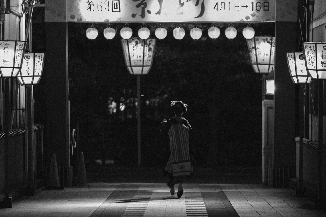 Traditional Geisha Maiko alleyway Gion Kyoto Japan at night. Black and white photography by Darren Gill