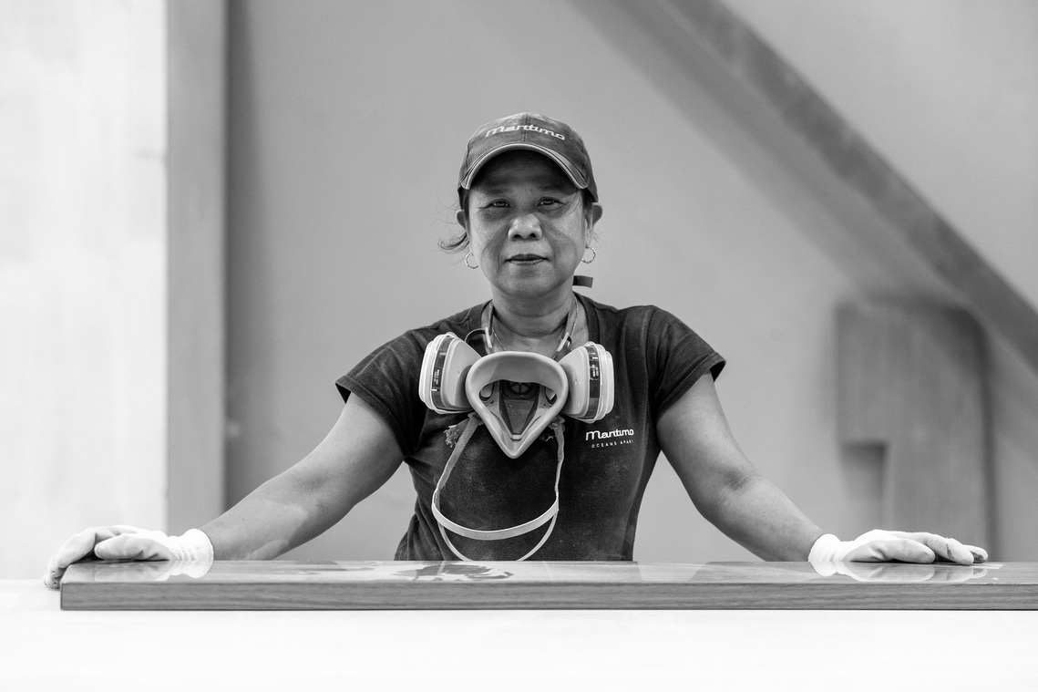 Portrait of a Maritimo Yachts production team member working on yacht cabinetry photographed by Darren Gill