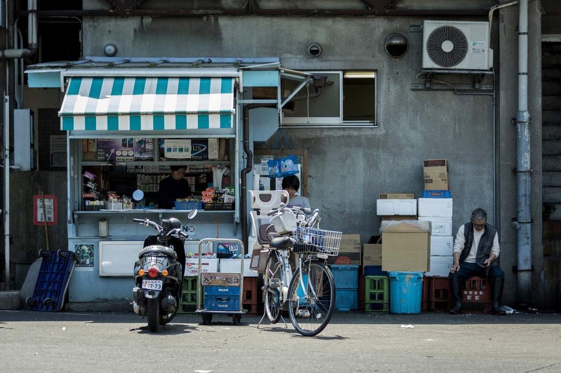 Small shop in alleyway of Tsukiji Fish Market in Tokyo Japan. Photography by Darren Gill