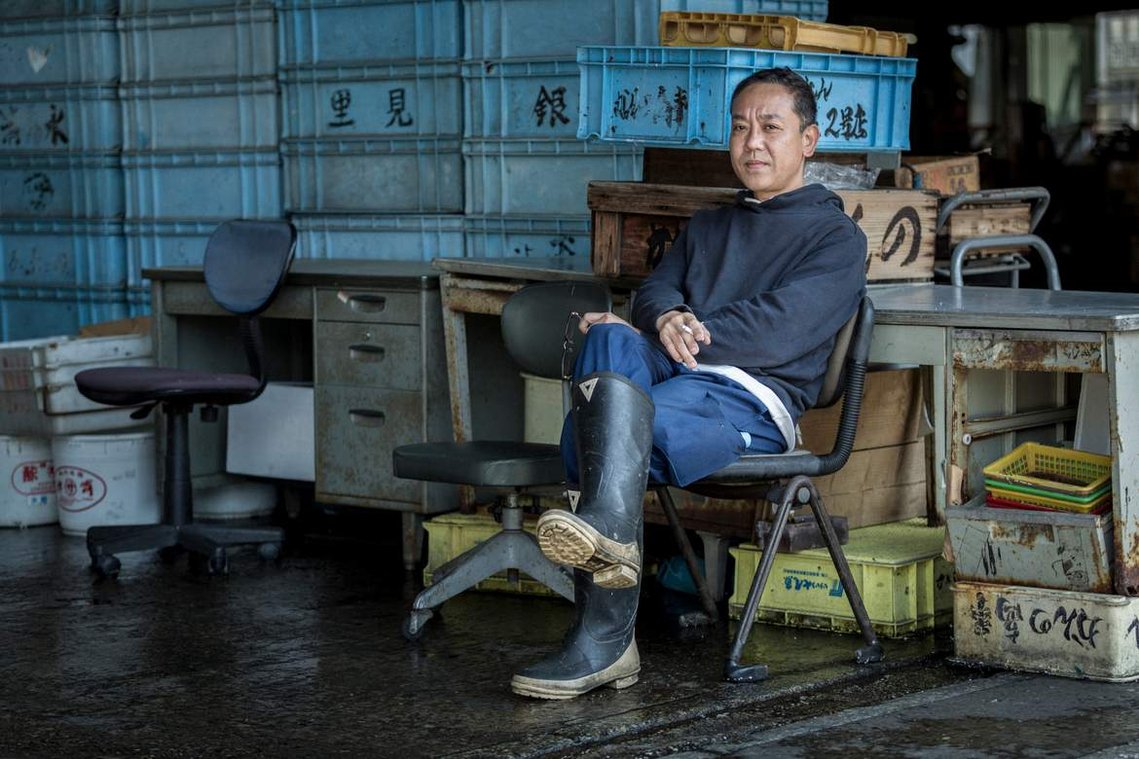 Portrait of Japanese worker at Tsukiji Fish market in Tokyo Japan. Photography by Darren Gill