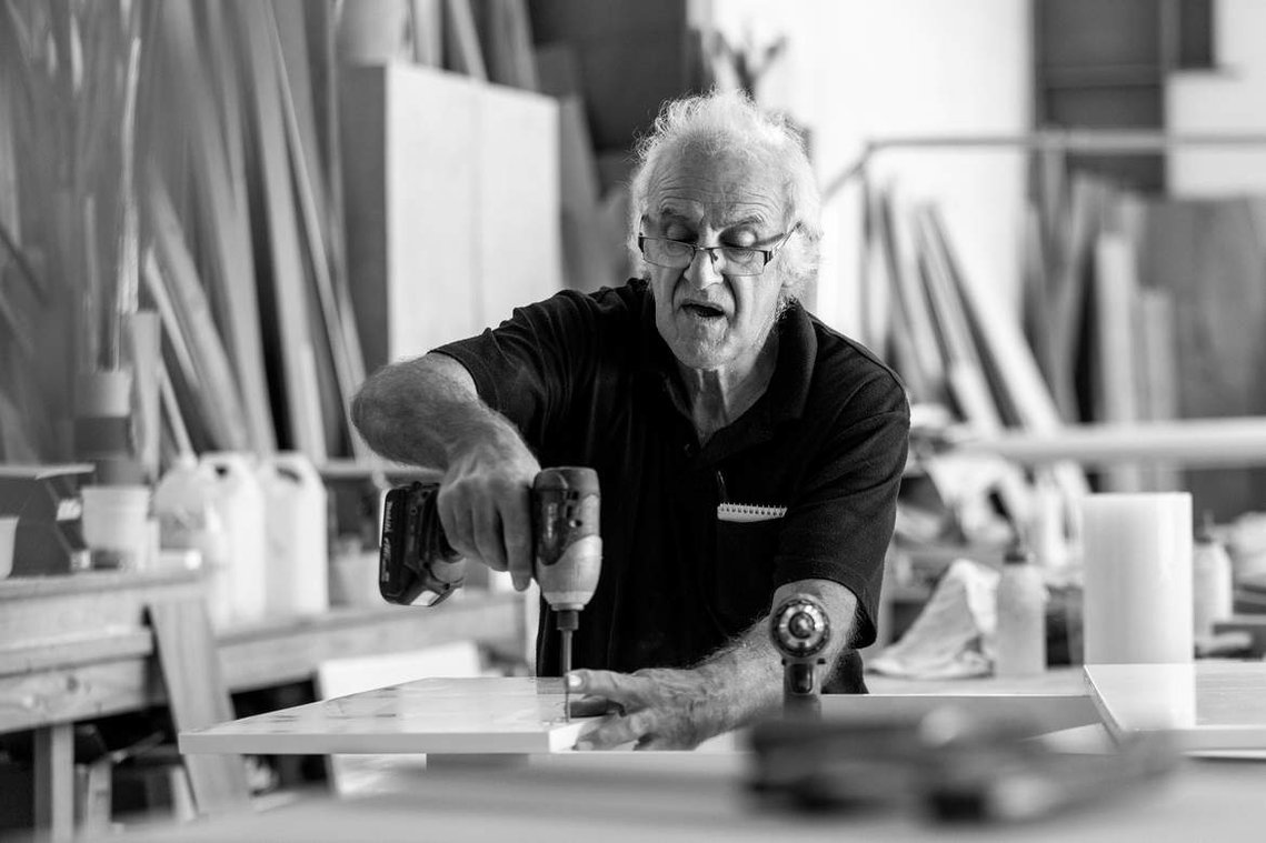 Maritimo Yachts production factory team member working with some timber. Photography by Darren Gill
