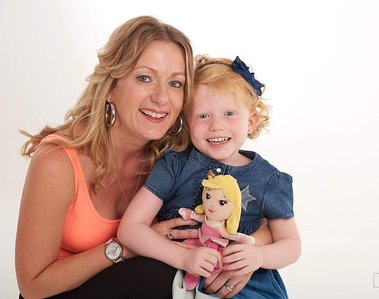 Young woman with little girl holding a rag doll and both looking at the camera

Portrait Photography by Clive Allcorn