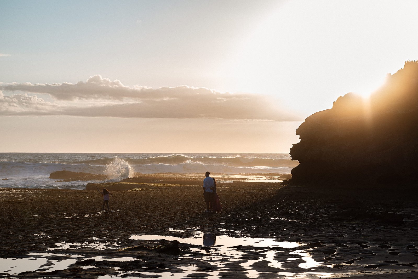 Family at beach on the Mornington Peninsula golden hour, glowing reflection and waves crashing