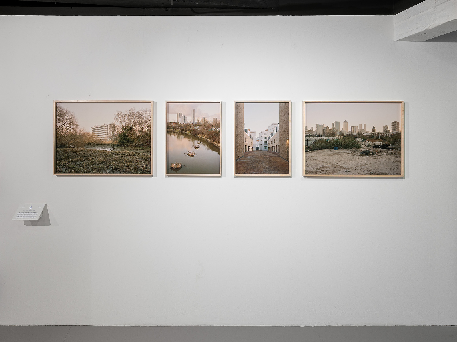 View of the photographic exhibition setup with fine art prints and custom frames at the Building Centre, London