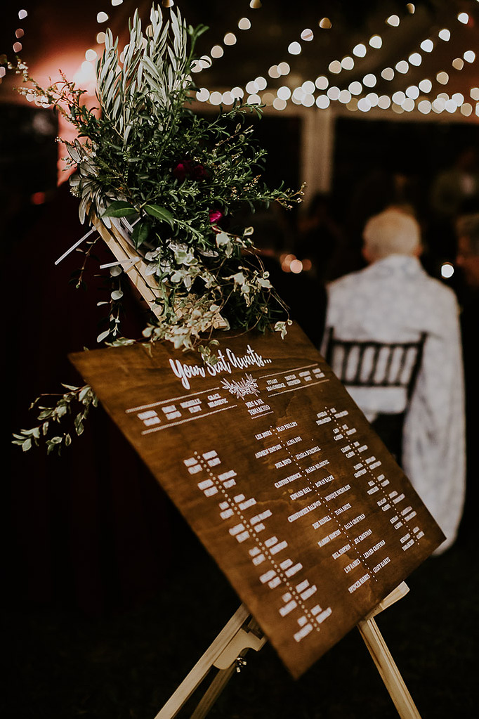 Hand lettered wooden wedding seating chart - side view