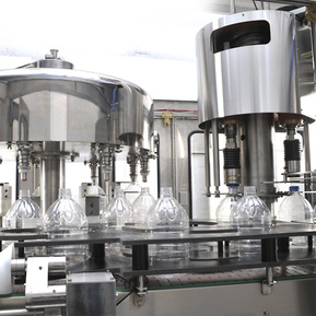 Monobloc rotary bottle filling and screw capping machine