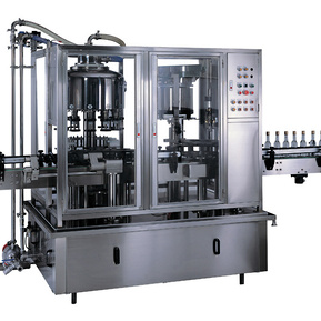 Monobloc rotary bottle filling and screw capping machine