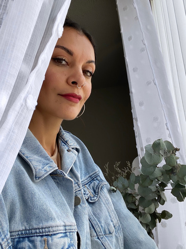 Ev Marquee portrait in front of a window