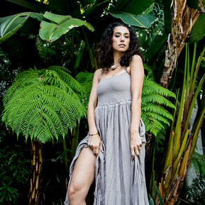 A goddess portrait against a tropical paradise location