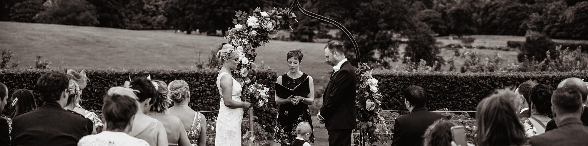 bride and groom outdoor ceremony in black and white photograph