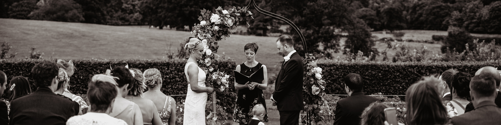 bride and groom outdoor ceremony in black and white photograph