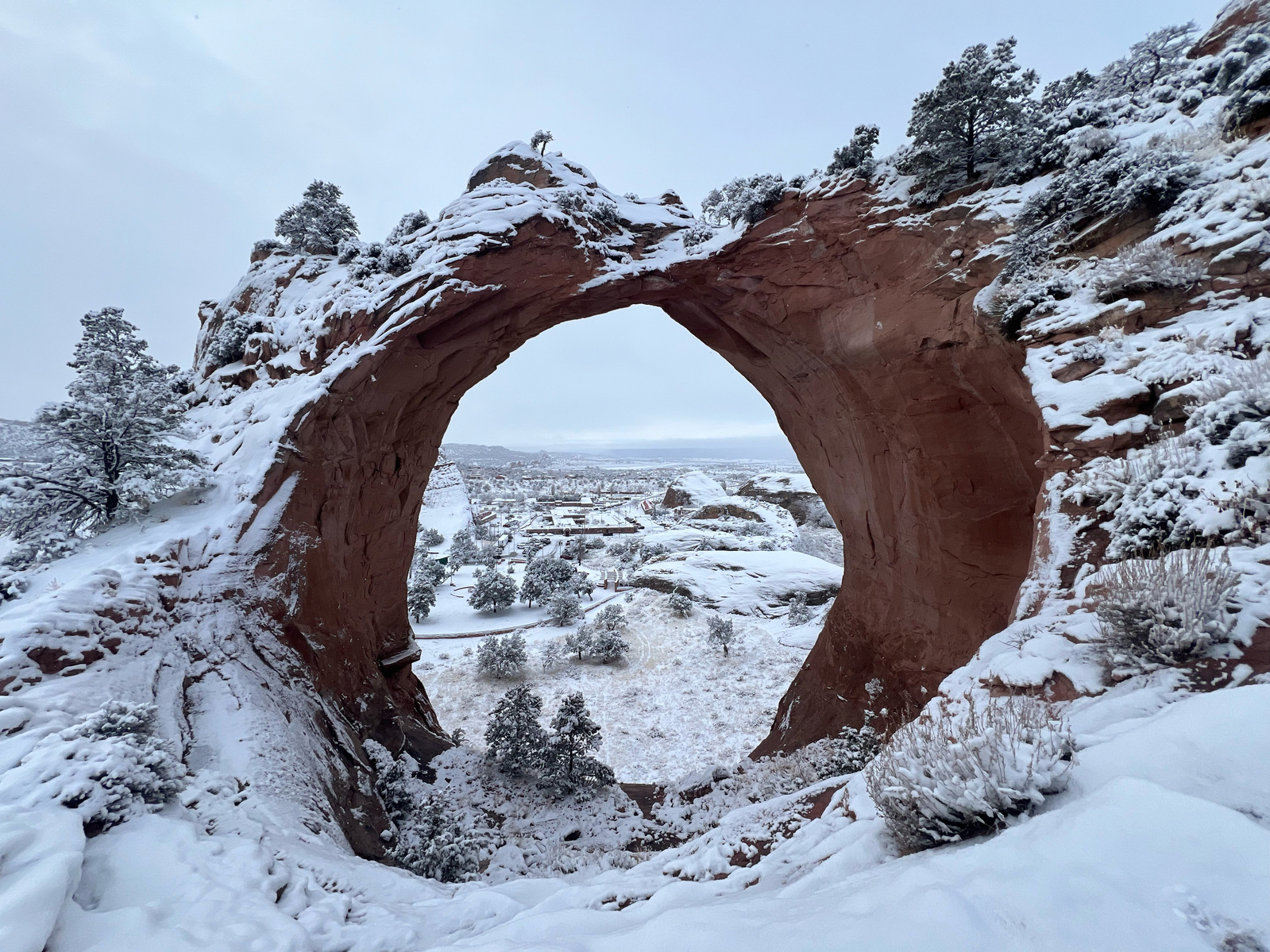 Window Rock monument covered in snow
