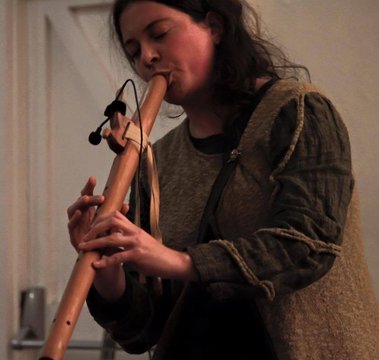 Anna PLaying Native American Style flute gifted to her by Jeff Norman of Okehampton Devon, Photo by Tracey Amhof at Oke Acoustic club