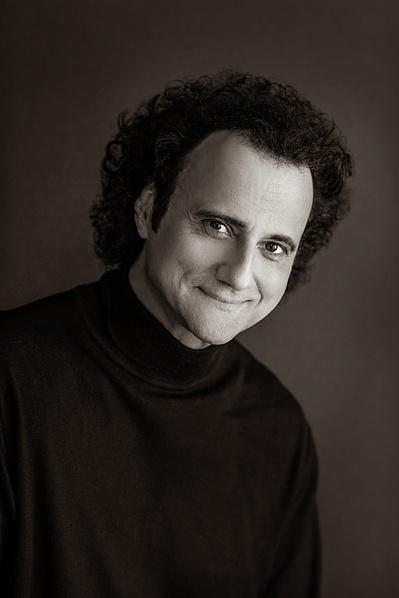 B&W Headshot of male opera singer in black turtleneck