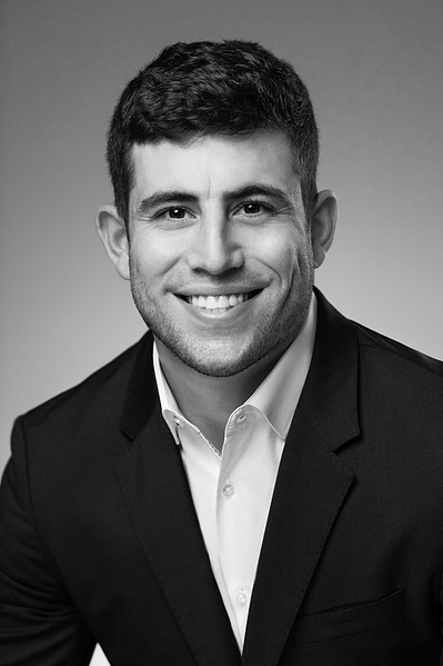 B&W Studio portrait of young handsome male executive