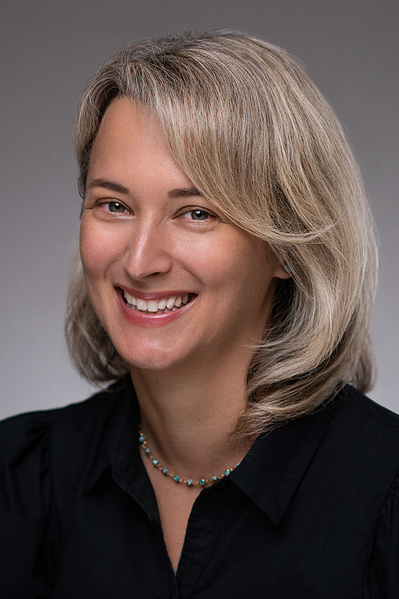 Young attractive blonde smiling executive studio Headshot