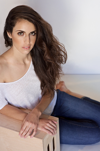 Young brunette model 3/4 body shot in Studio