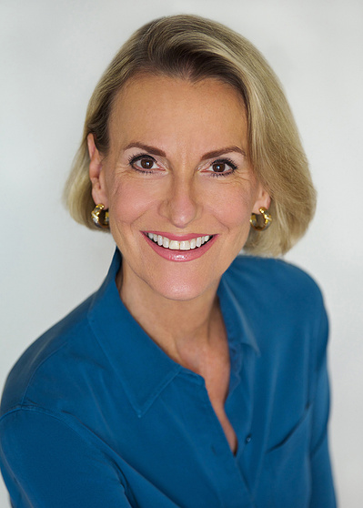 Female Executive HS with teal shirt.