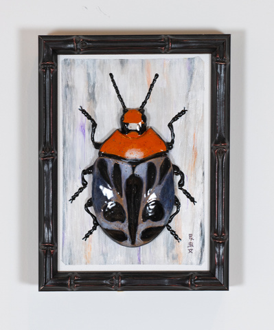 Framed Black and red beetle, ceramic art piece