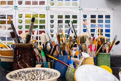 A collection of artists brushes and color swatches