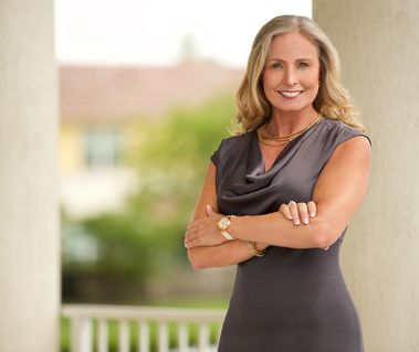 Attractive blond Female attorney with arms crossed, outdoors